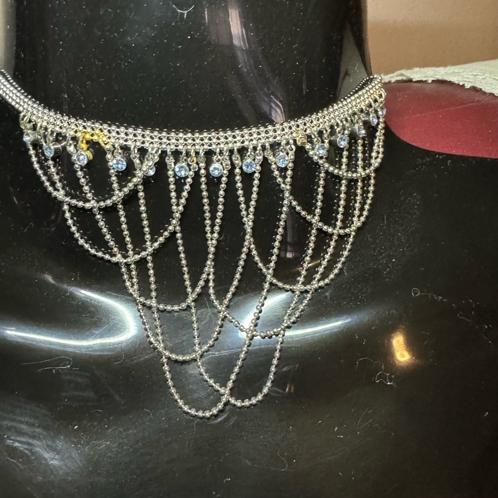 Delicate silver bead and rhinestone necklace with draped crisscrossed beads